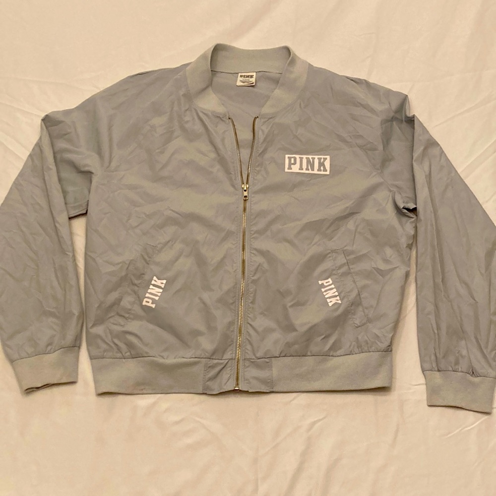 Lightly used silver windbreaker jacket. PINK by Victoria’s Secret.  Size M